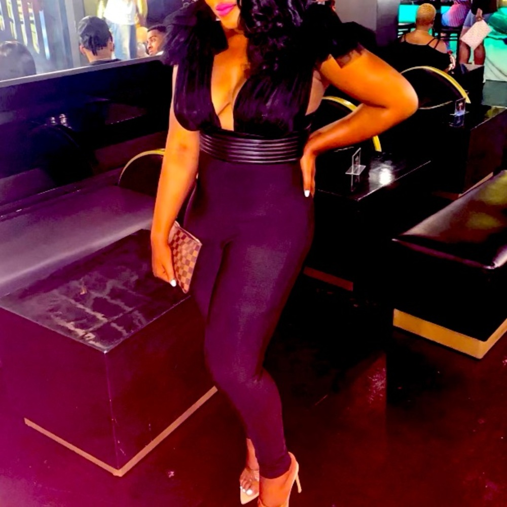 Black bandages of pants jump suit. Worn once
